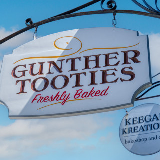 Guther Tooties Carved Wood Hanging Blade Sign by Zebra Visuals